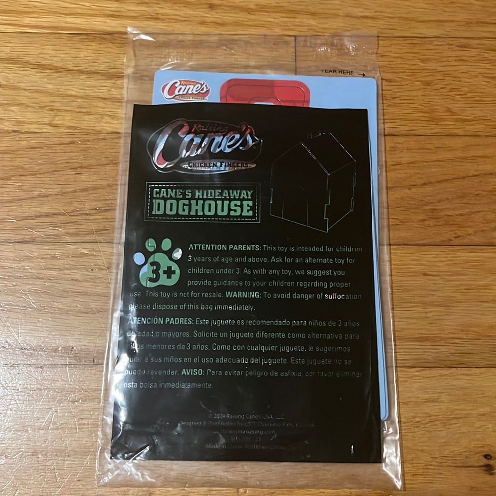NWT New Raising Cane’s Cane’s Hideaway Doghouse Kids Activity Toy